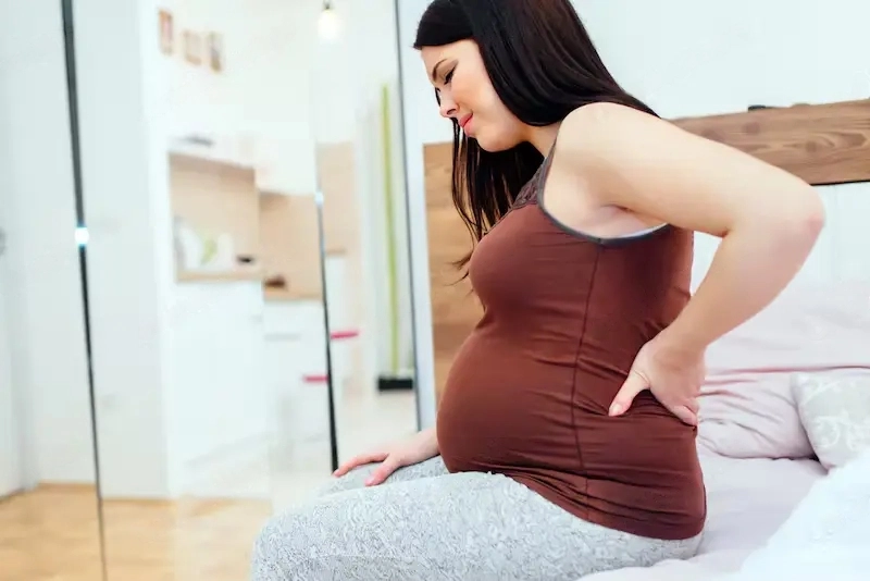 What Are Common Discomforts During Pregnancy? A pregnant woman having back pain