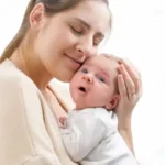 mother holding baby transformed