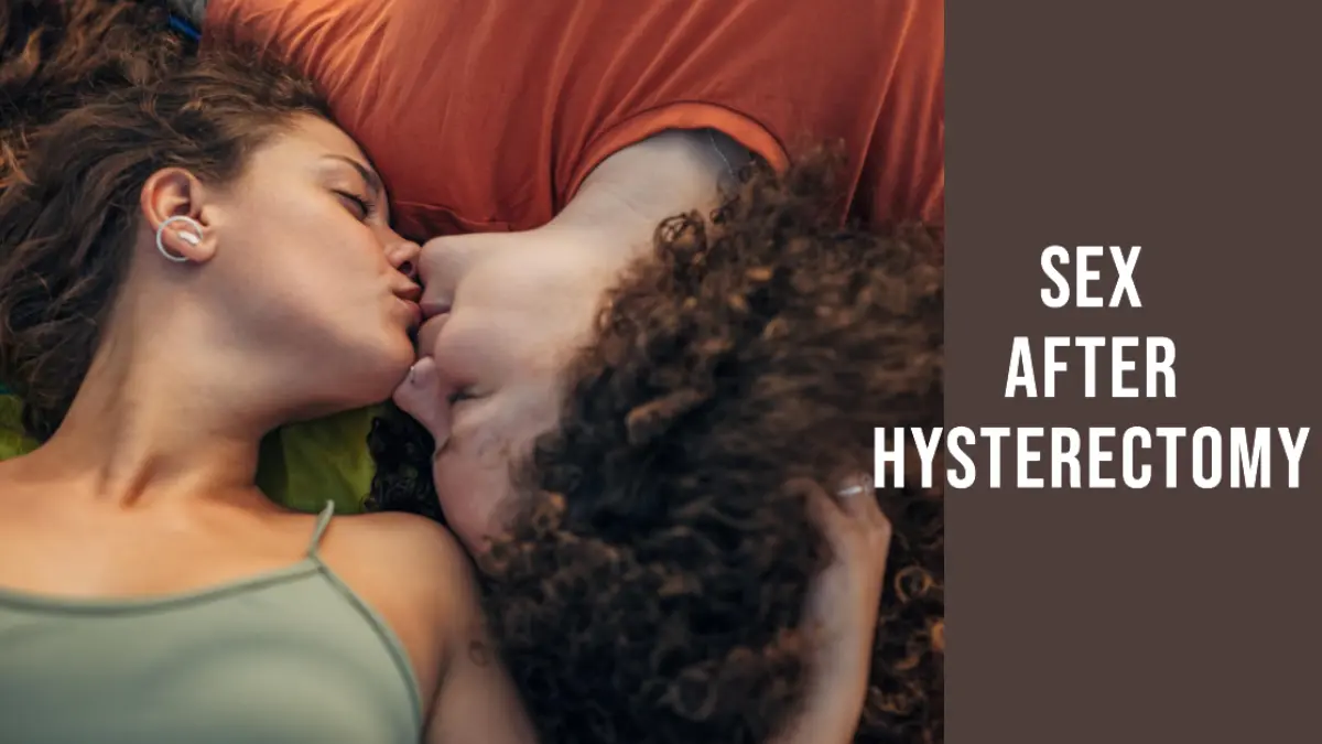 A couple kissing lying on a bed - Sex After Hysterectomy