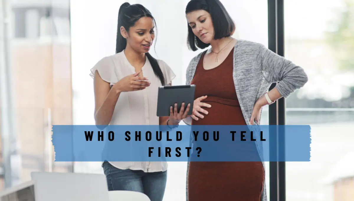 a pregnant woman talking with her boss