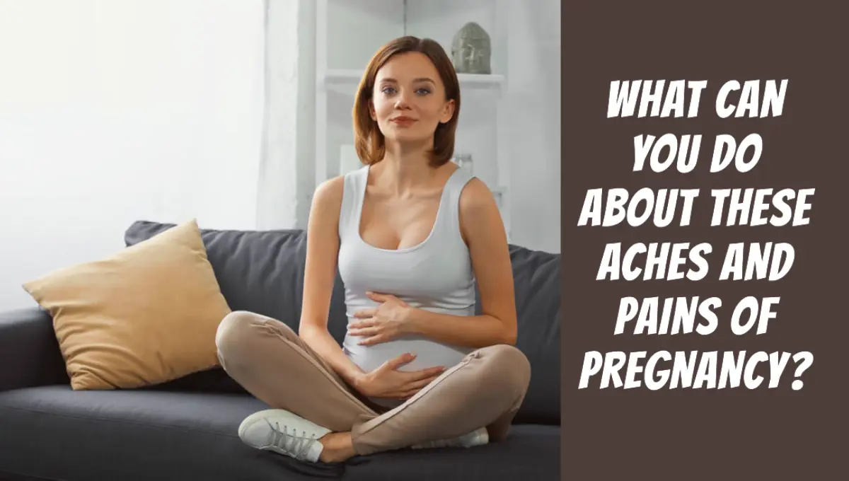 a pregnant woman smiling at camera while sitting on couch with crossed legs