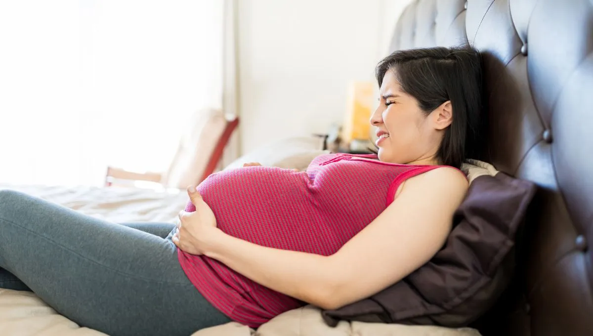 a pregnant woman experiencing Braxton Hicks contractions.