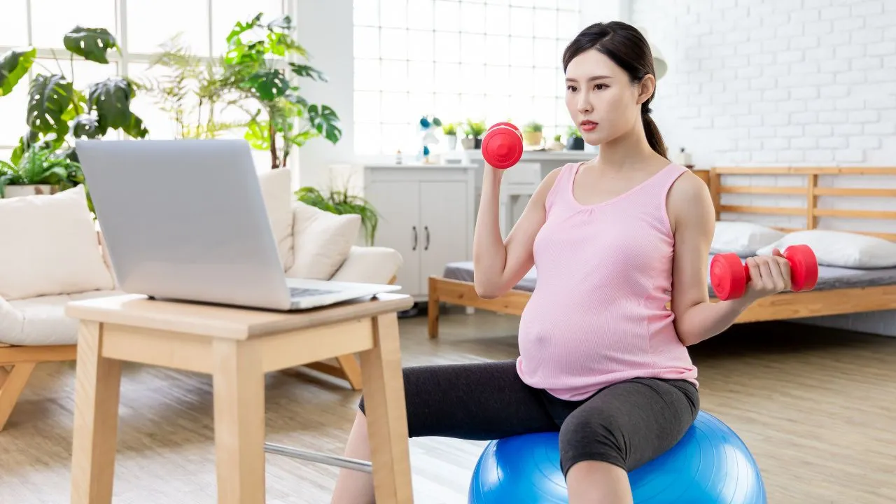 a pregnant woman attending prenatal yoga classes