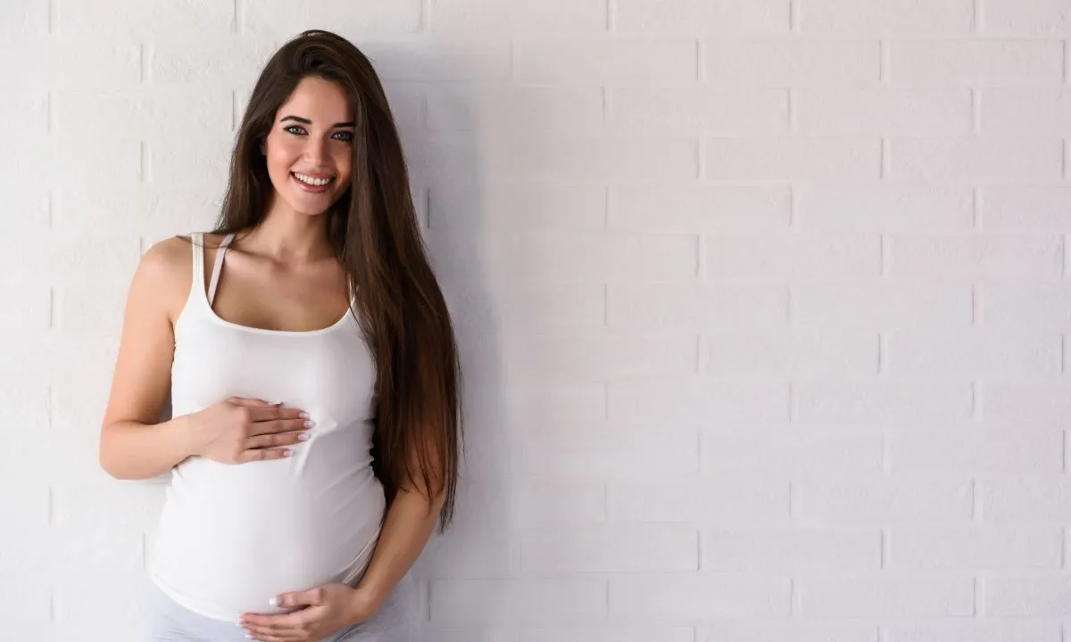 a beautiful, smiling pregnant woman.