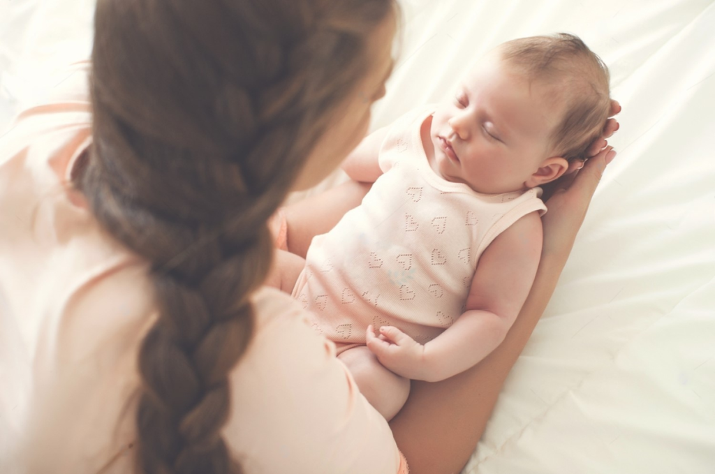 a sleeping baby - concept of newborn skin care tips for post-pregnancy moms