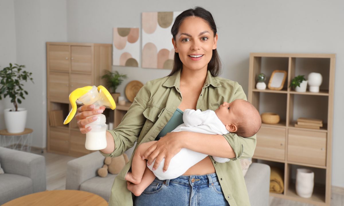 a woman feeding her baby milk through a bottle - Breastfeeding Supply Calculator